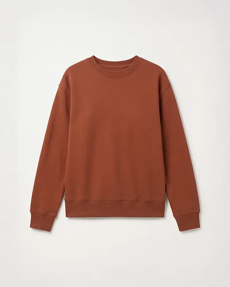 A plain product photograph of a rust-coloured sweatshirt on a white background.